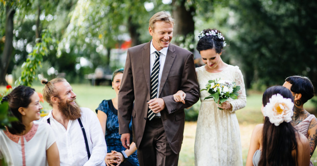 Father and daughter on their way to the altar.